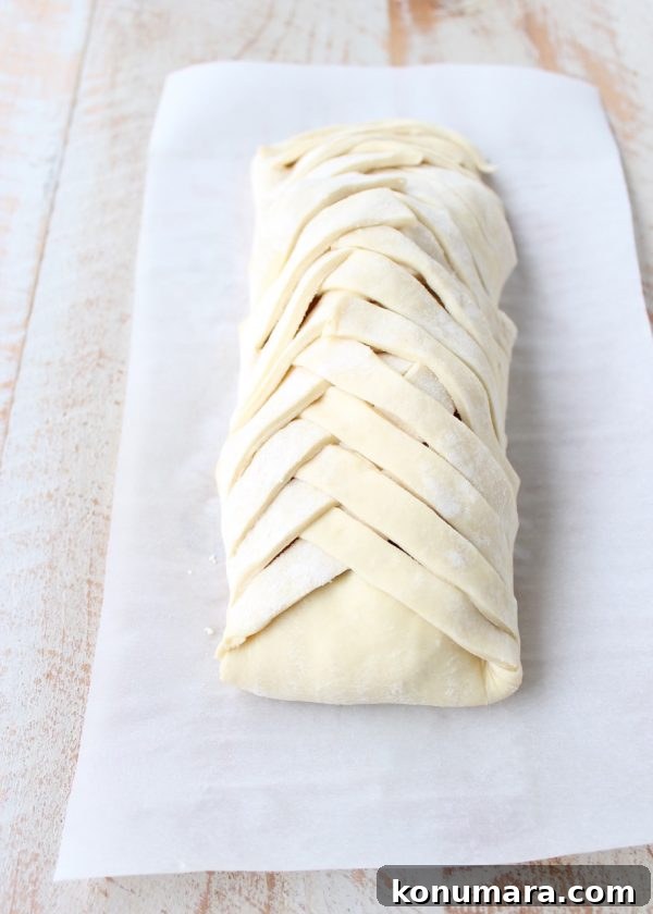 Brie-Stuffed Apple Strudel Recipe 5 Golden puff pastry braid on apple strudel.