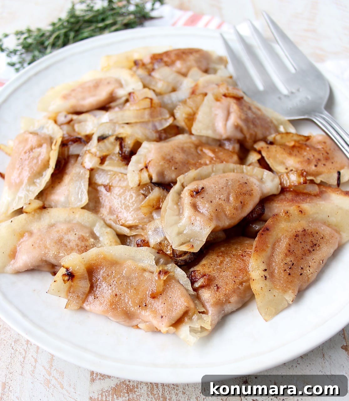 Sweet Potato Pierogi Recipe with Caramelized Onions 11 In this easy pierogies recipe, wonton wrappers are filled with leftover mashed potatoes, then pan seared with caramelized onions for a delicious meal!