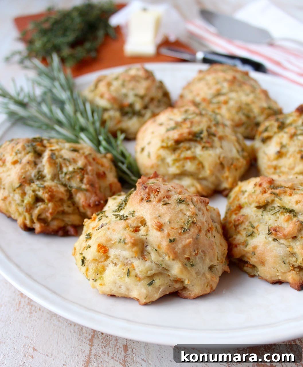Stuffed Biscuits Recipe: Savory Filling Ideas 2 stuffing biscuits on a plate with fresh rosemary