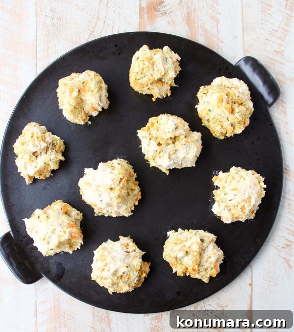 Stuffed Biscuits Recipe: Savory Filling Ideas 7 biscuit dough on a black round baking stone