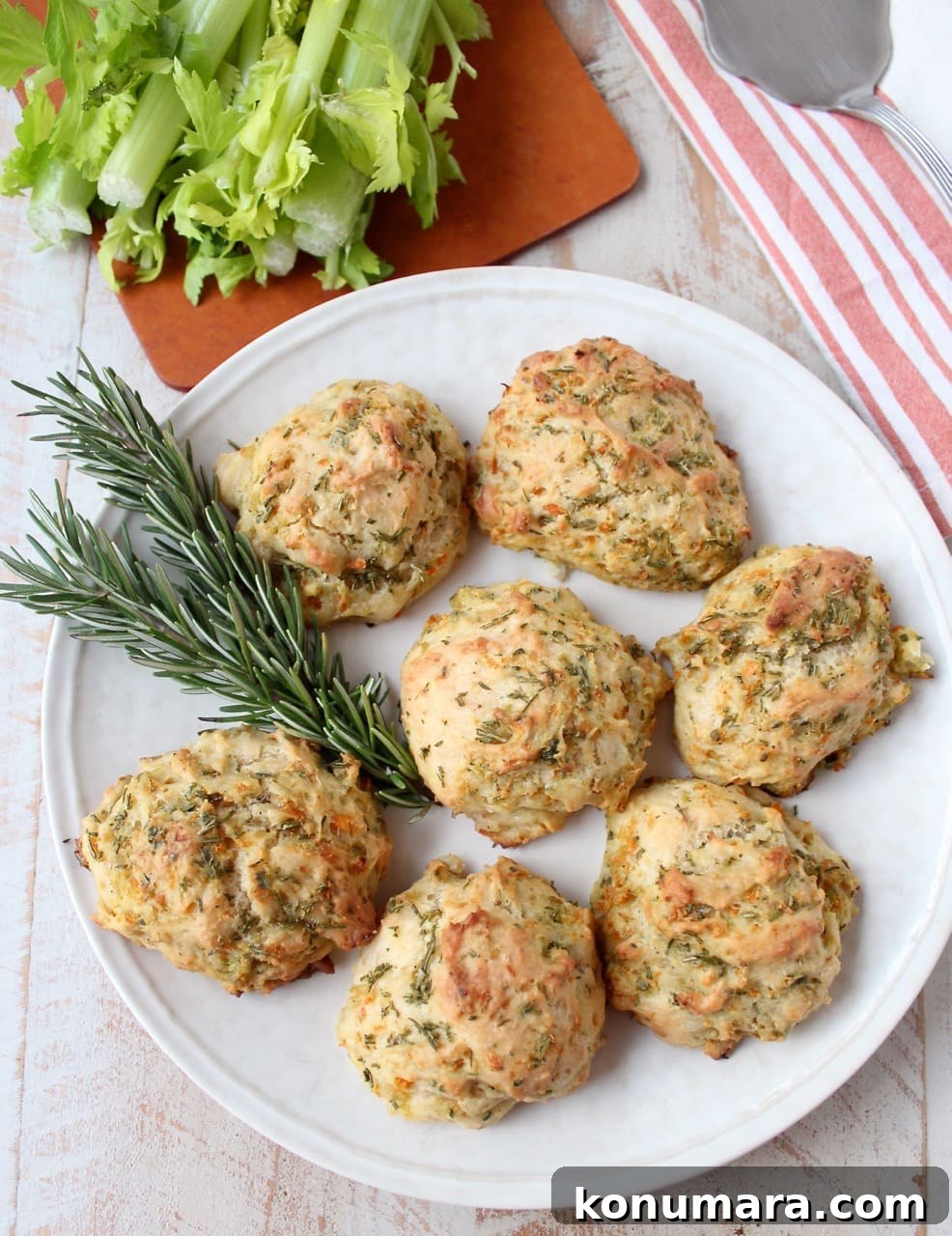 Stuffed Biscuits Recipe: Savory Filling Ideas 8 stuffing biscuits on a plate with fresh rosemary