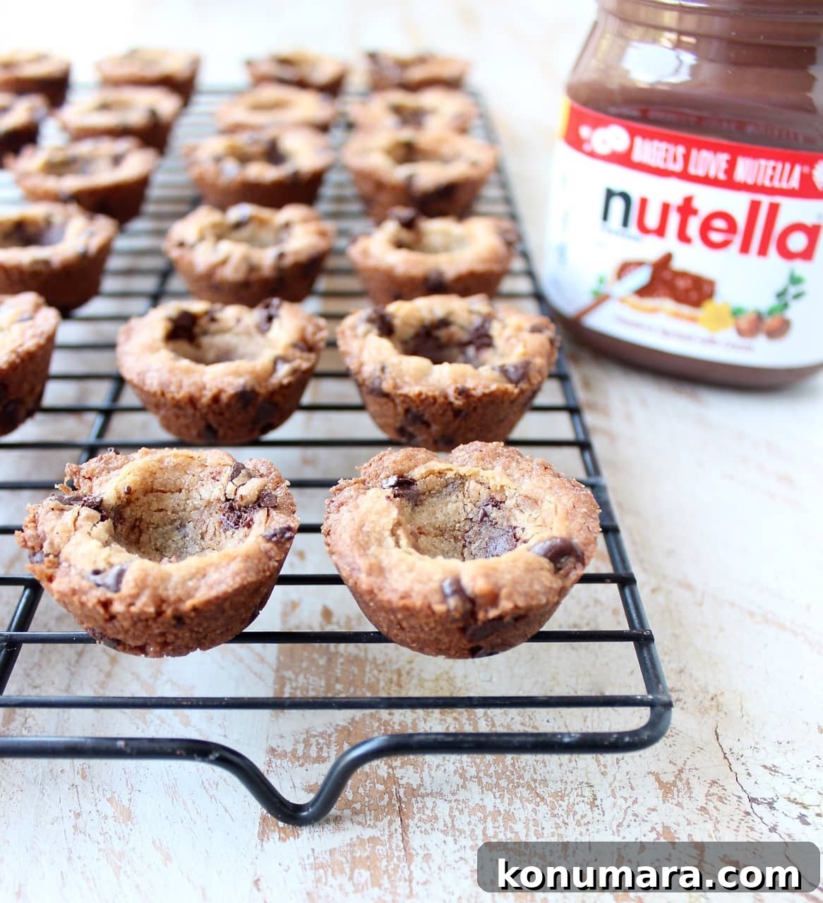 Nutella-Stuffed Chocolate Chip Cookie Cups Recipe 7 A simple chocolate chip cookie recipe is transformed into delicious chocolate chip cookie cups filled with Nutella Hazelnut Spread!