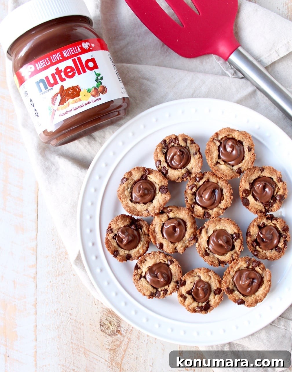 Nutella-Stuffed Chocolate Chip Cookie Cups Recipe 14 A simple chocolate chip cookie recipe is transformed into delicious chocolate chip cookie cups filled with Nutella Hazelnut Spread!
