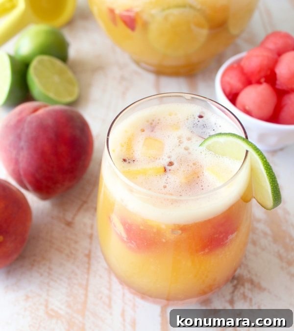 This white peach sangria is the perfect summer cocktail recipe combining refreshing white wine with fresh peaches, nectarines and lime juice!