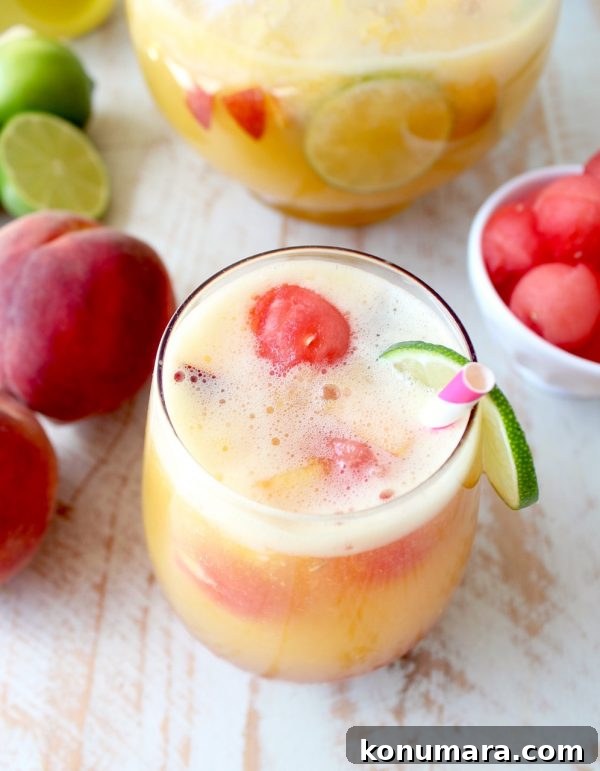 This white peach sangria is the perfect summer cocktail recipe combining refreshing white wine with fresh peaches, nectarines and lime juice!