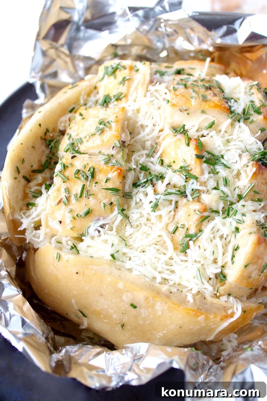 Leftover Thanksgiving turkey & cranberry sauce is made into a delicious pull apart bread recipe filled with mozzarella cheese & topped with rosemary butter!
