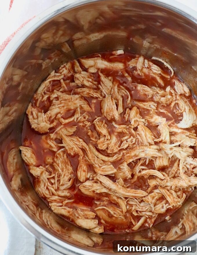 cooked, shredded buffalo chicken in an Instant Pot