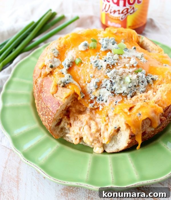 Close up of buffalo chicken dip filling in a bread bowl