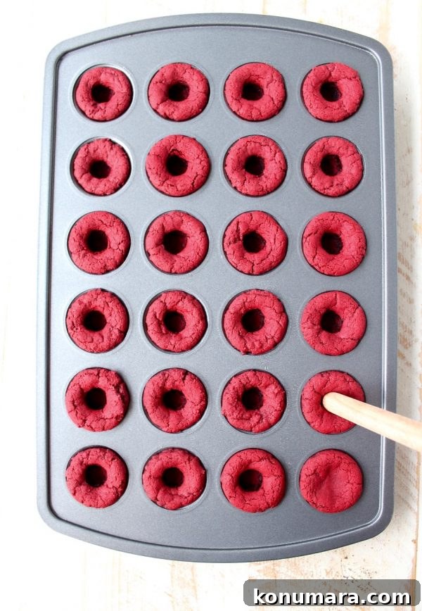 Red velvet cookie cups filled with cream cheese frosting are a delicious and adorable dessert recipe that's also easy to make! Perfect for Valentine's Day, birthdays or any day you're craving a sweet treat!