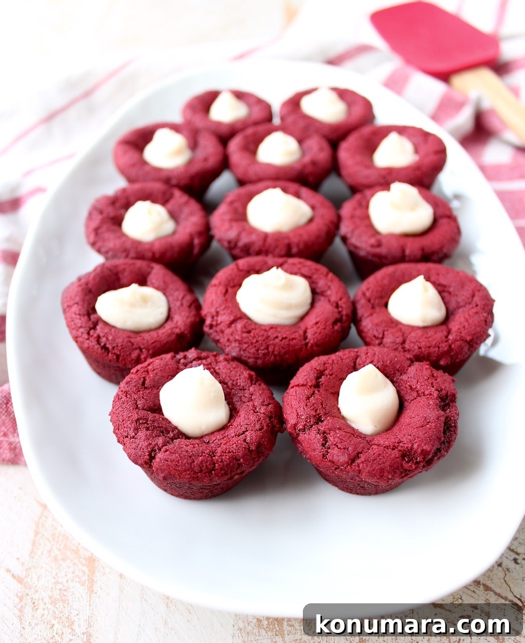 Red velvet cookie cups filled with cream cheese frosting are a delicious and adorable dessert recipe that's also easy to make! Perfect for Valentine's Day, birthdays or any day you're craving a sweet treat!