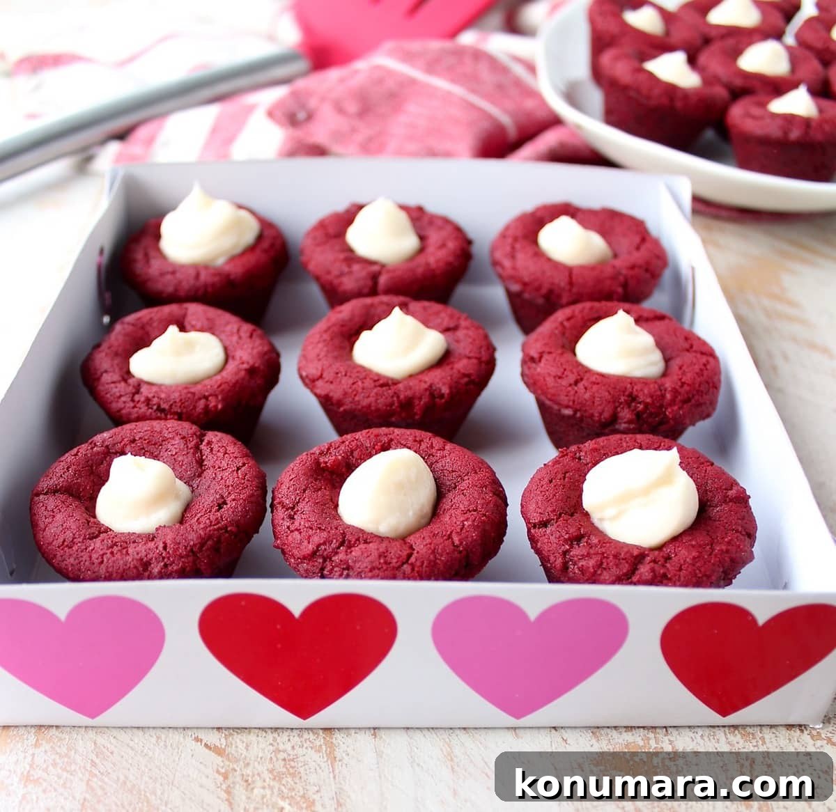 Red velvet cookie cups filled with cream cheese frosting are a delicious and adorable dessert recipe that's also easy to make! Perfect for Valentine's Day, birthdays or any day you're craving a sweet treat!