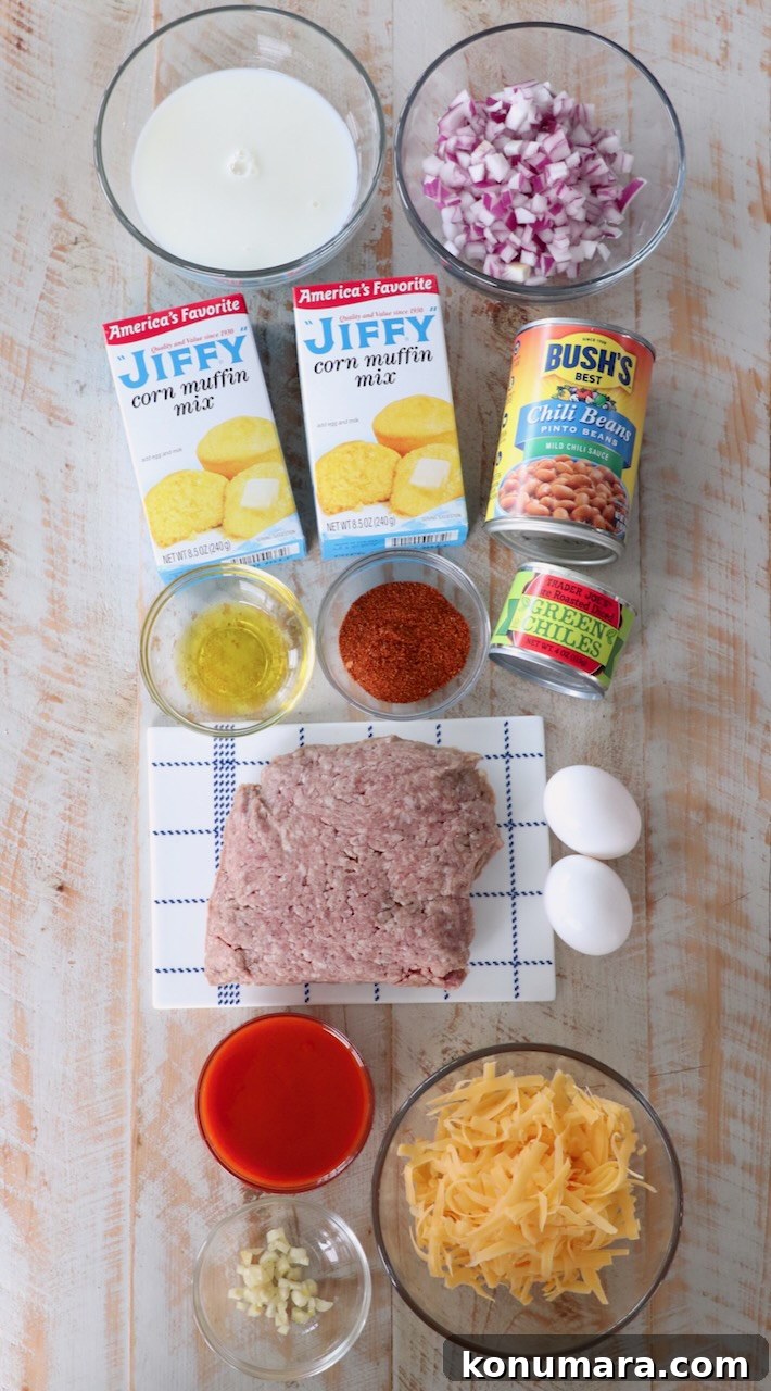 ingredients for cornbread chili pie on white wood board
