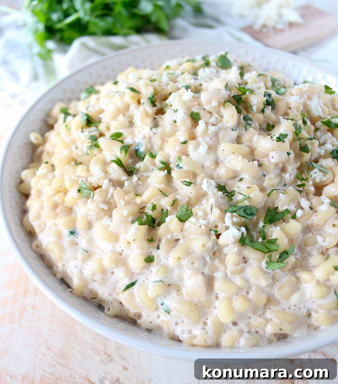 Mexican street corn mac and cheese in a white bowl. 