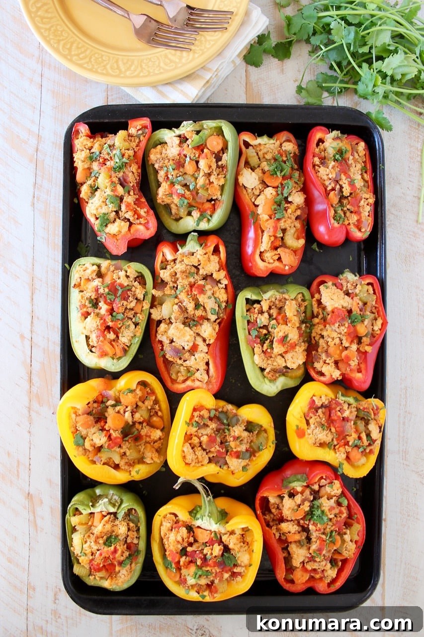 Buffalo chicken stuffed bell peppers on baking sheet