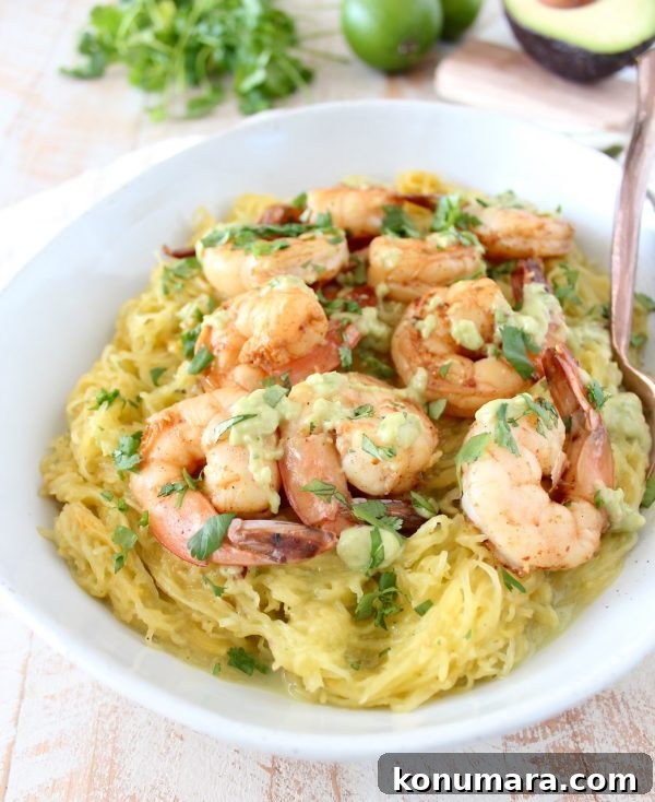 Bowl of spaghetti squash with shrimp and avocado sauce, overhead view
