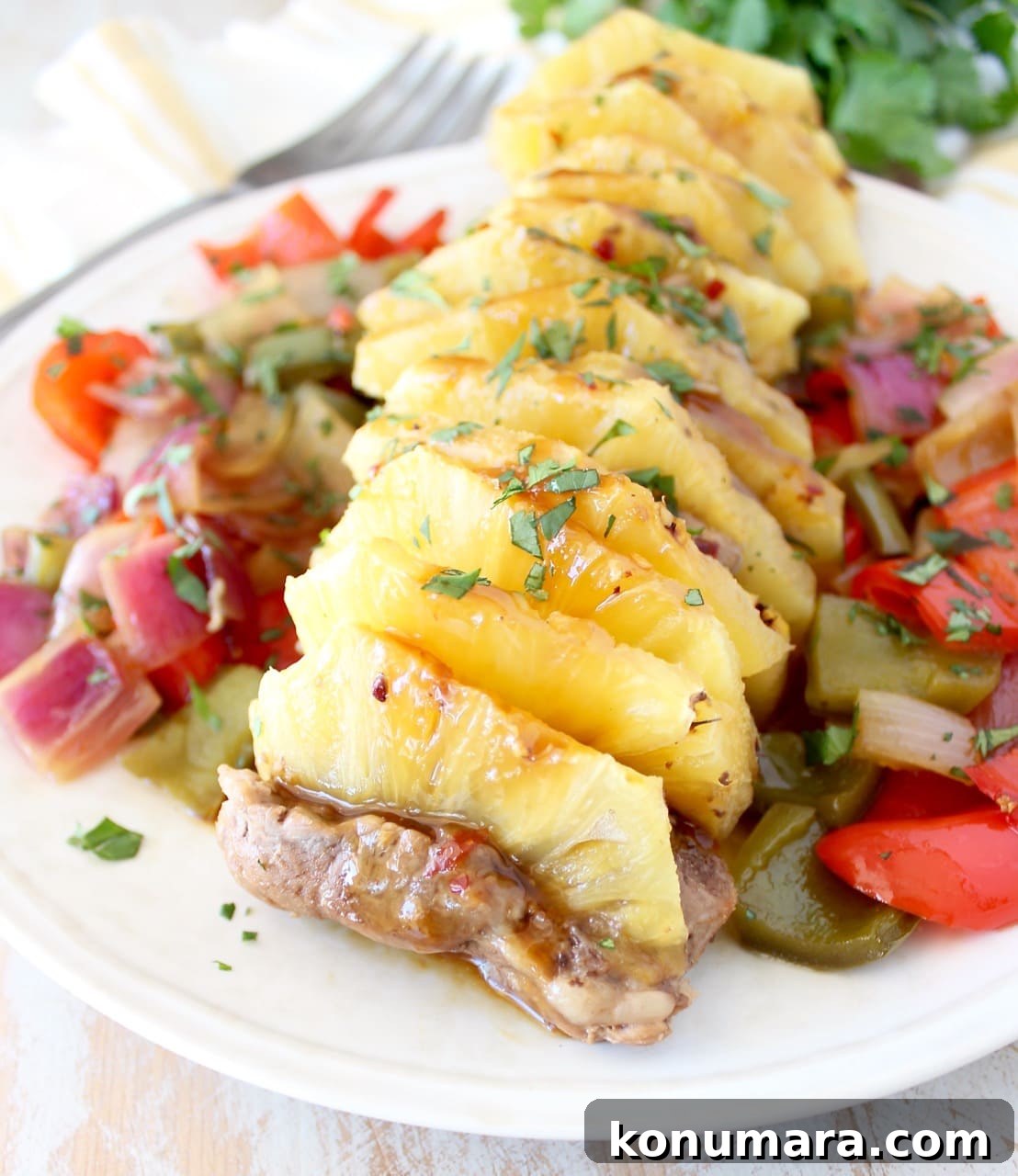 Glazed Pineapple Teriyaki Pork Tenderloin Recipe 4 pork tenderloin filled with pineapple slices on a plate with vegetables