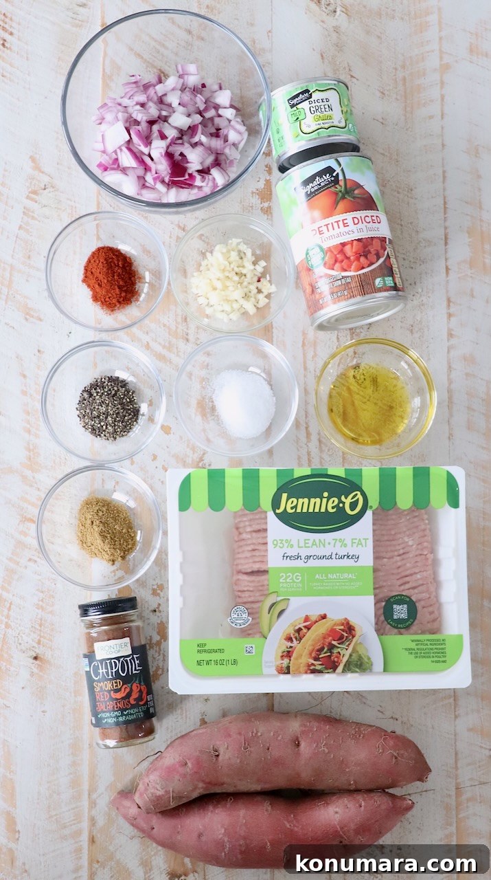 Smoky Chipotle Chili Stuffed Sweet Potatoes Recipe 3 ingredients for chili stuffed sweet potatoes on white wood board