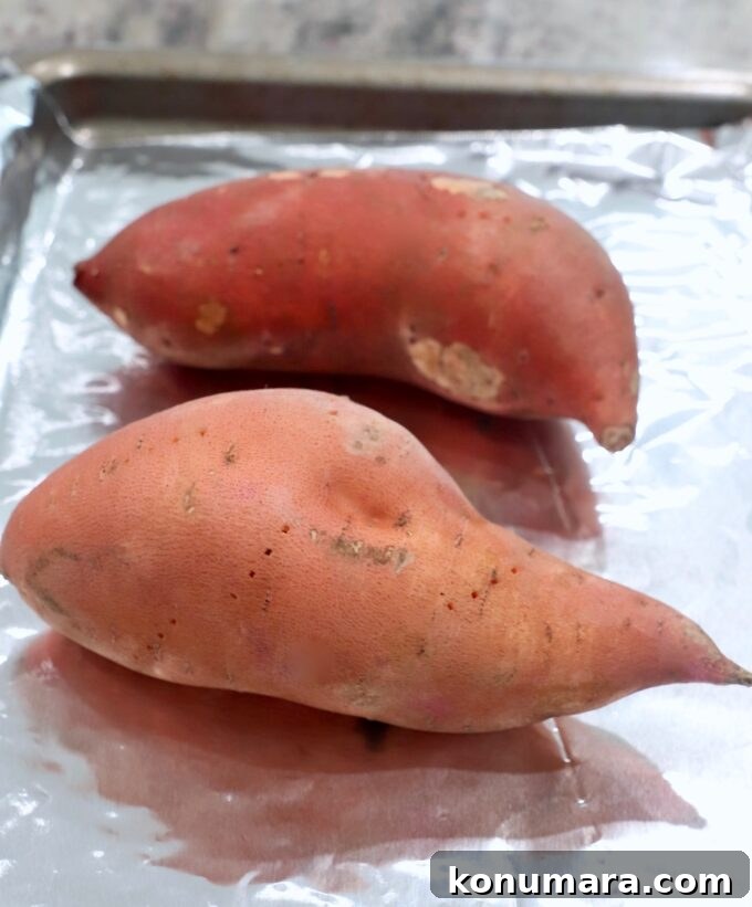 Smoky Chipotle Chili Stuffed Sweet Potatoes Recipe 4 sweet potatoes on foil lined baking sheet