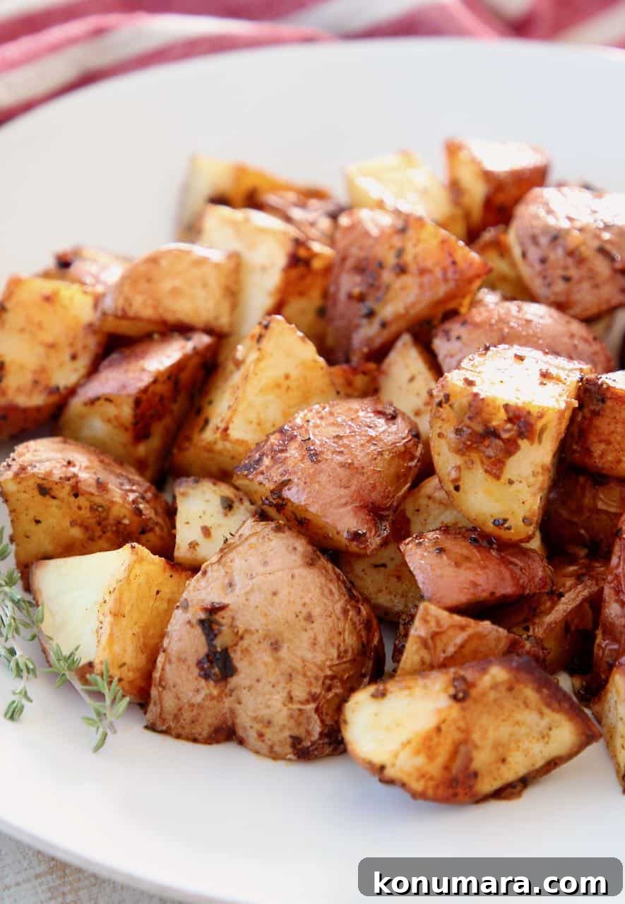 Crispy Cajun Roasted Potatoes Recipe 2 Roasted cubed potatoes on white plate