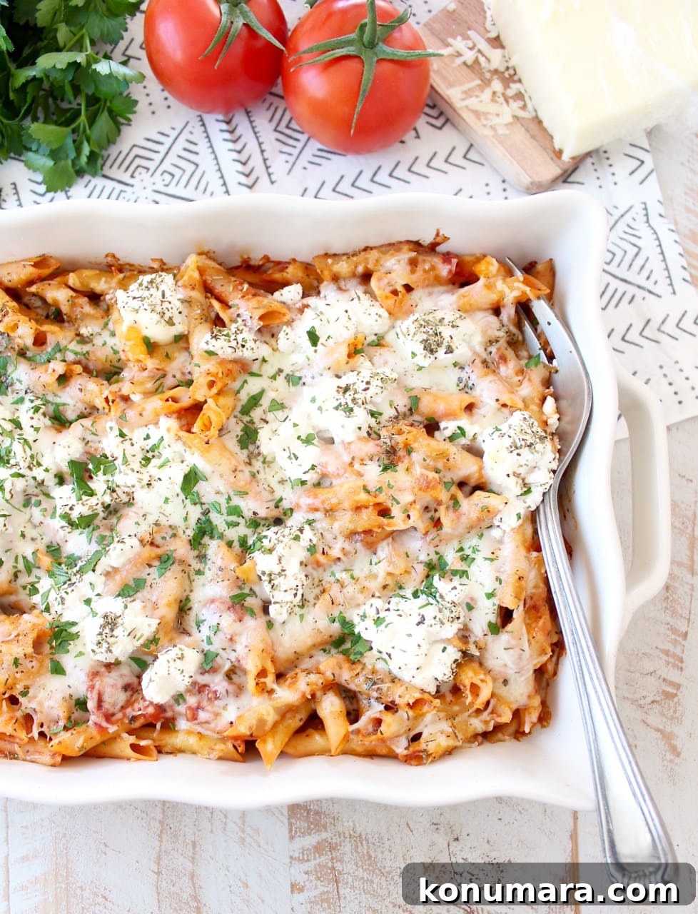 baked pasta in casserole dish with large serving fork