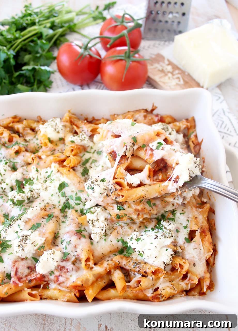 baked pasta with cheese on top in casserole dish