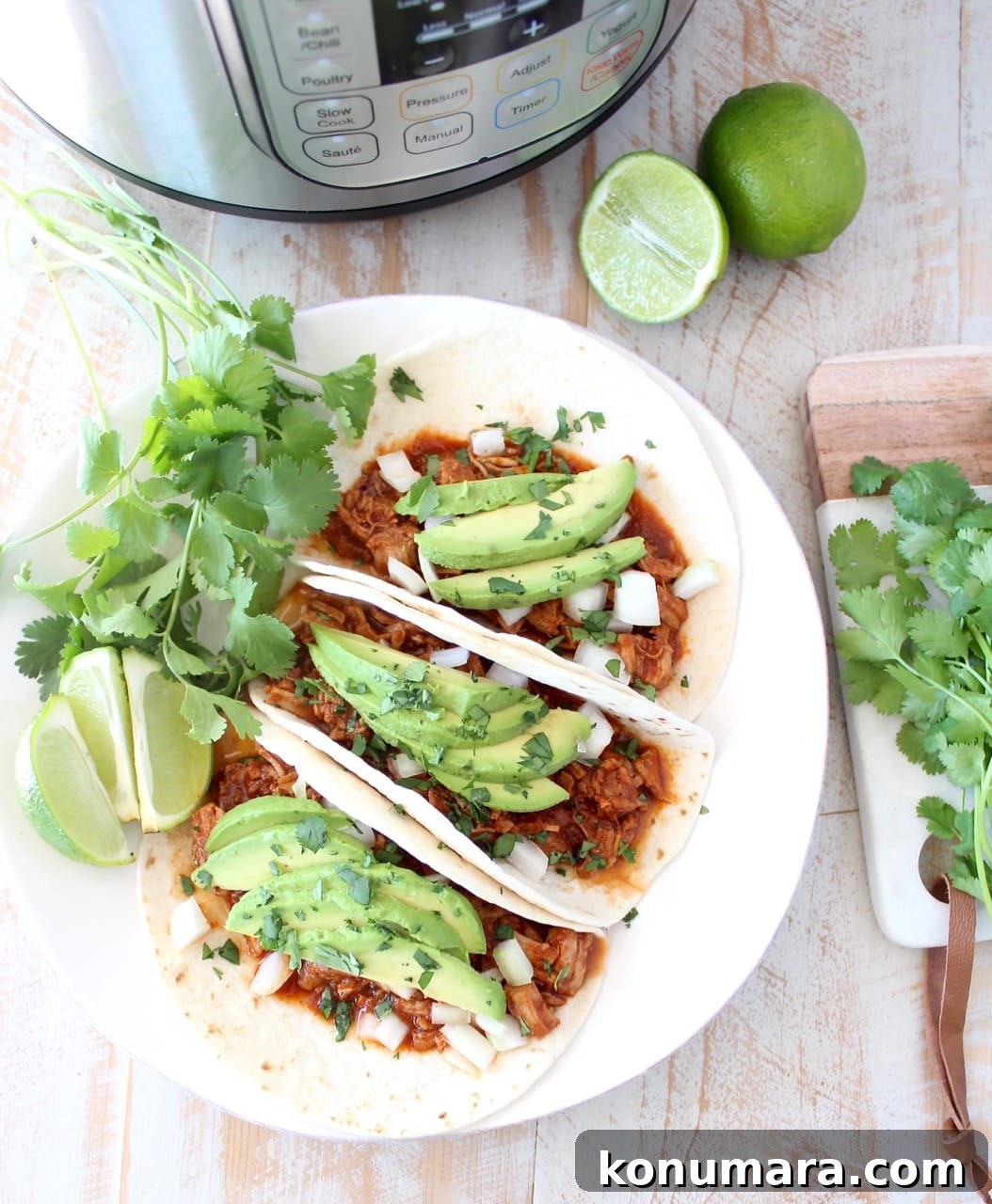 Instant pot pulled pork tacos are easy to make in under an hour with lean pork tenderloin, a delicious combination of spices and a sriracha honey tomato sauce!
