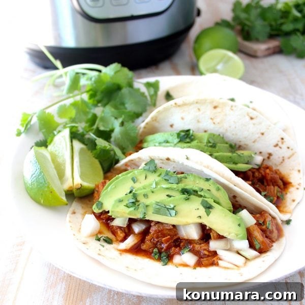 Instant pot pulled pork tacos are easy to make in under an hour with lean pork tenderloin, a delicious combination of spices and a sriracha honey tomato sauce!
