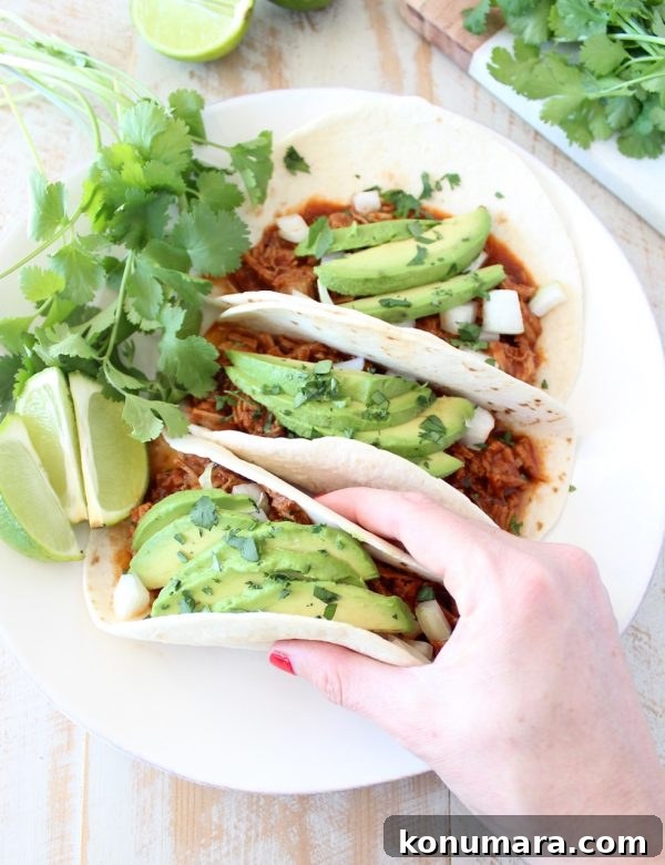 Instant pot pulled pork tacos are easy to make in under an hour with lean pork tenderloin, a delicious combination of spices and a sriracha honey tomato sauce!