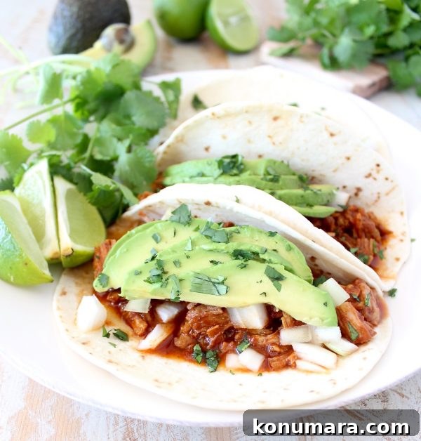 Instant pot pulled pork tacos are easy to make in under an hour with lean pork tenderloin, a delicious combination of spices and a sriracha honey tomato sauce!