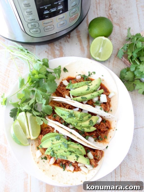 Instant pot pulled pork tacos are easy to make in under an hour with lean pork tenderloin, a delicious combination of spices and a sriracha honey tomato sauce!