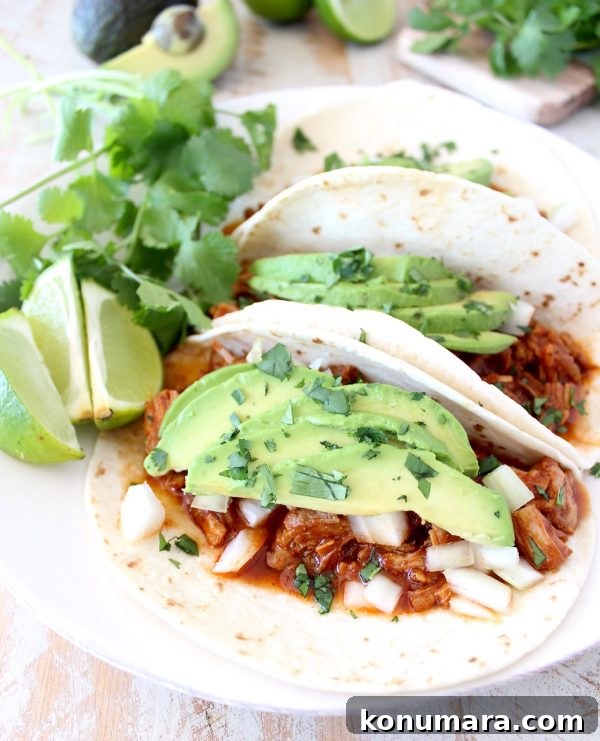 Instant pot pulled pork tacos are easy to make in under an hour with lean pork tenderloin, a delicious combination of spices and a sriracha honey tomato sauce!
