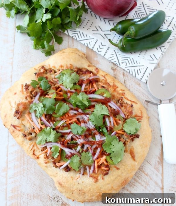 Banh Mi Pizza with cilantro and Sriracha drizzle