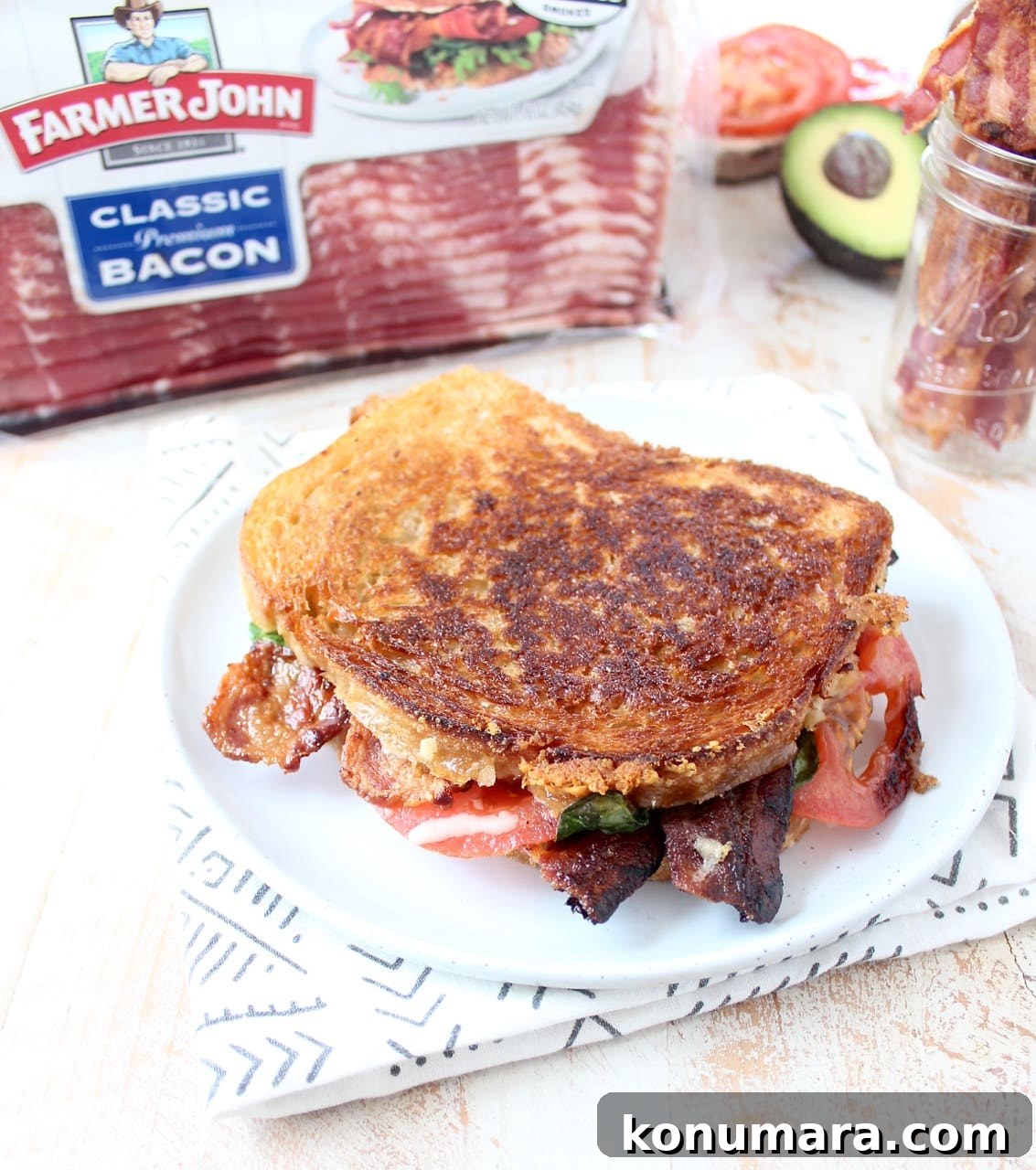 Grilled Cheese with Bacon, Tomato and Avocado 5 Close-up of melted gruyere on a grilled cheese sandwich with bacon and avocado