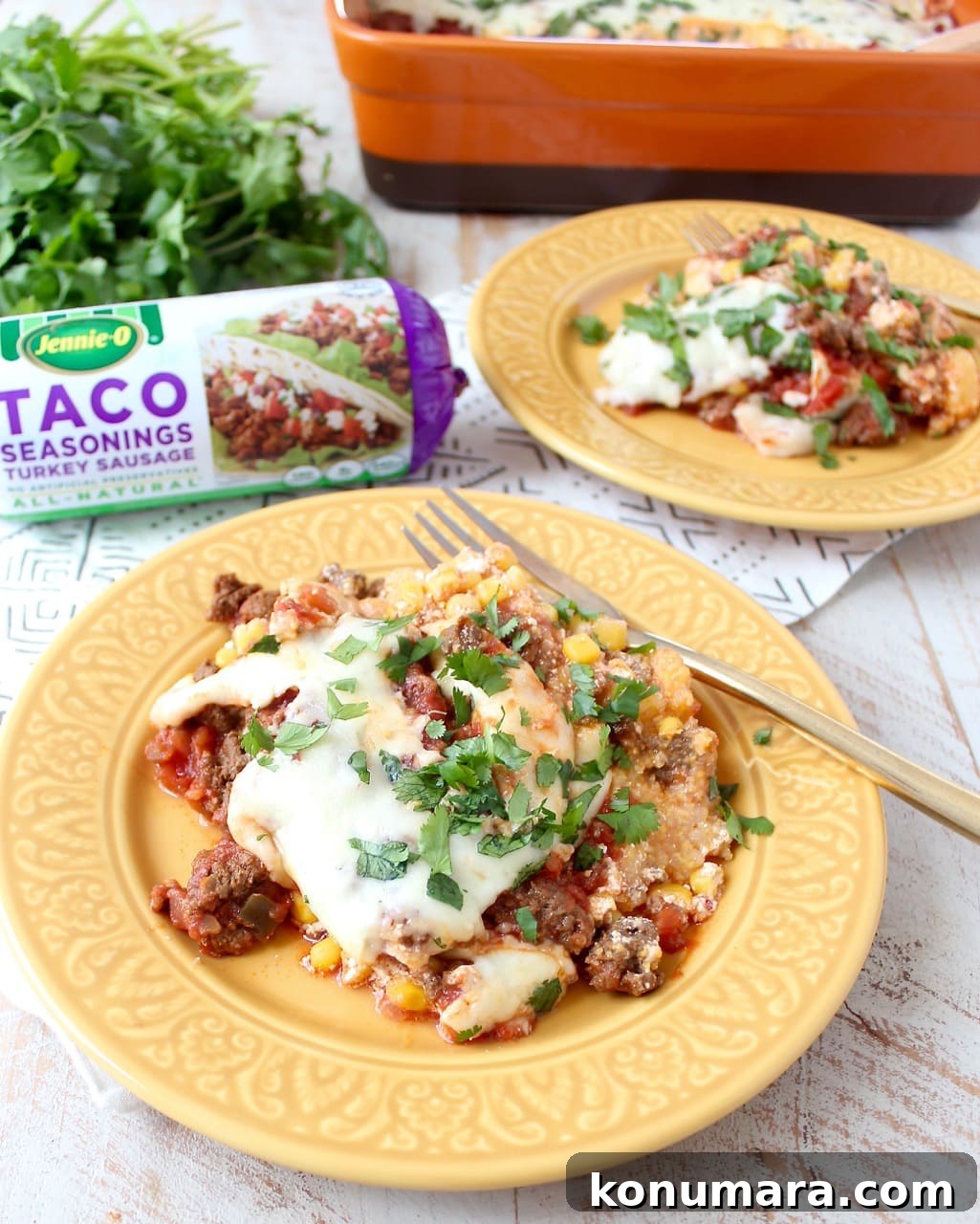 Taco seasoned turkey is layered with creamy polenta, sour cream, corn, salsa and cheese in this easy, gluten free taco casserole recipe, made in just 29 minutes! Taco Casserole on plate