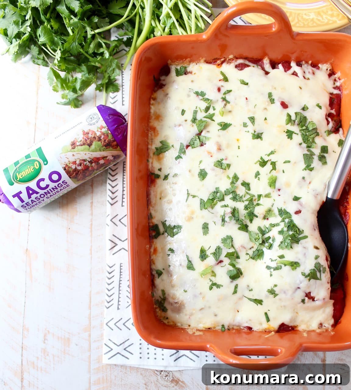 Taco seasoned turkey is layered with creamy polenta, sour cream, corn, salsa and cheese in this easy, gluten free taco casserole recipe, made in just 29 minutes! Taco Casserole in Casserole Dish