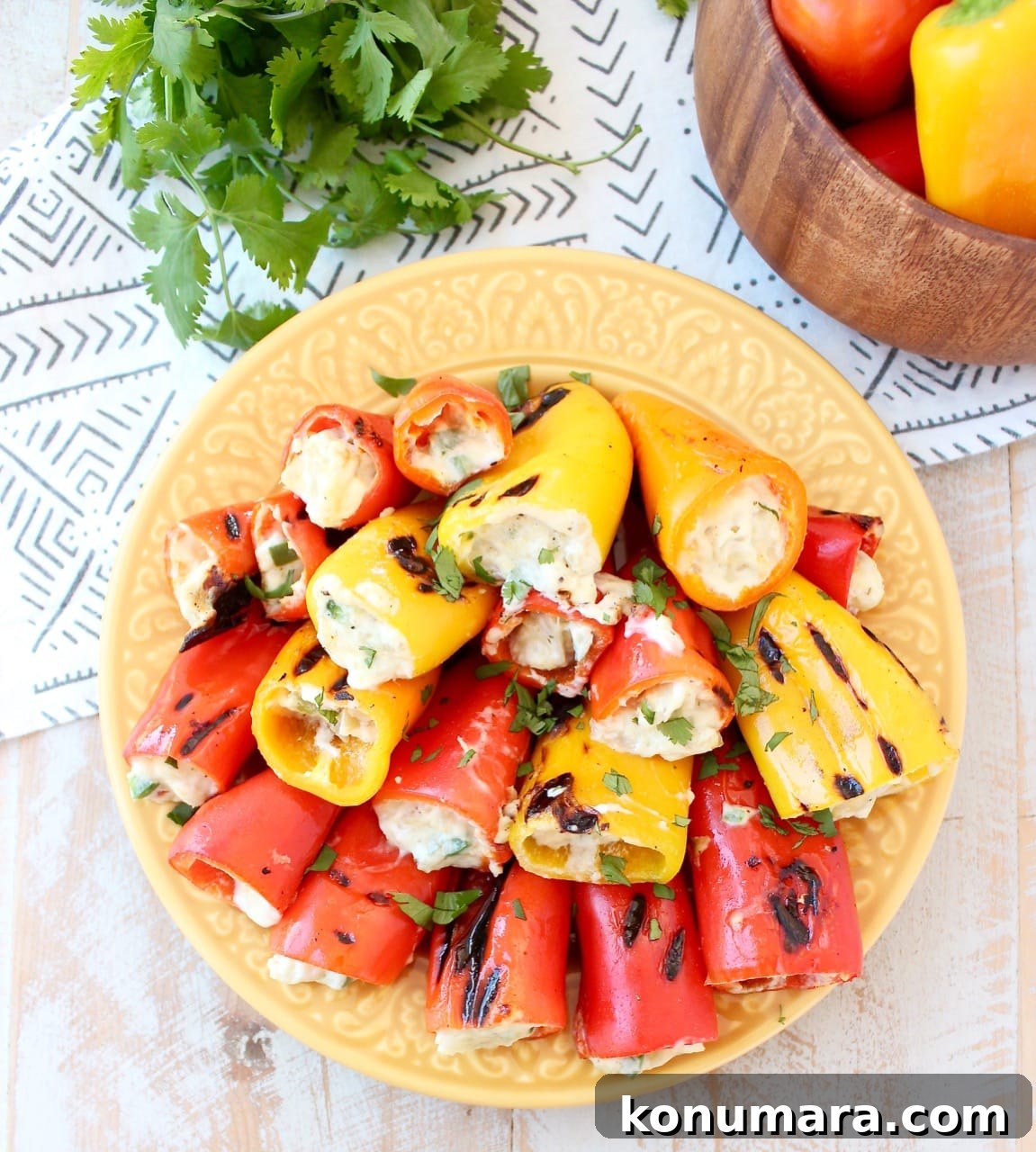 Grilled stuffed peppers are made with sweet mini peppers, filled with an easy, delicious creamy artichoke dip, creating the perfect appetizer for your next BBQ! Grilled Stuffed Mini Peppers