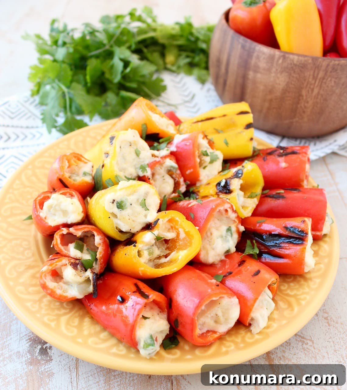Grilled stuffed peppers are made with sweet mini peppers, filled with an easy, delicious creamy artichoke dip, creating the perfect appetizer for your next BBQ! Colorful Grilled Stuffed Peppers with Cream Cheese