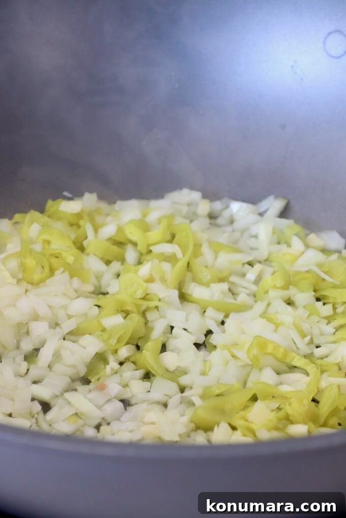 diced onions and sliced pepperoncinis in large pan