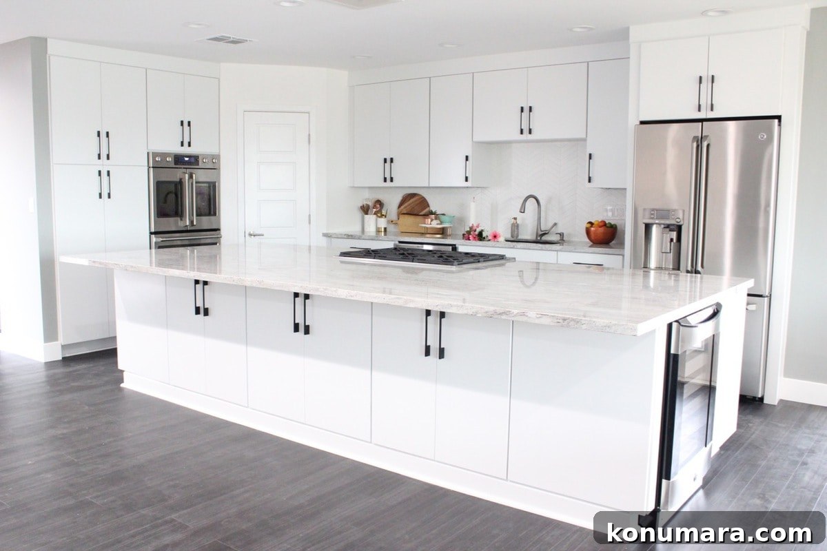 Kitchen Remodel with White Kitchen Cabinets are large 12 foot island with granite countertops