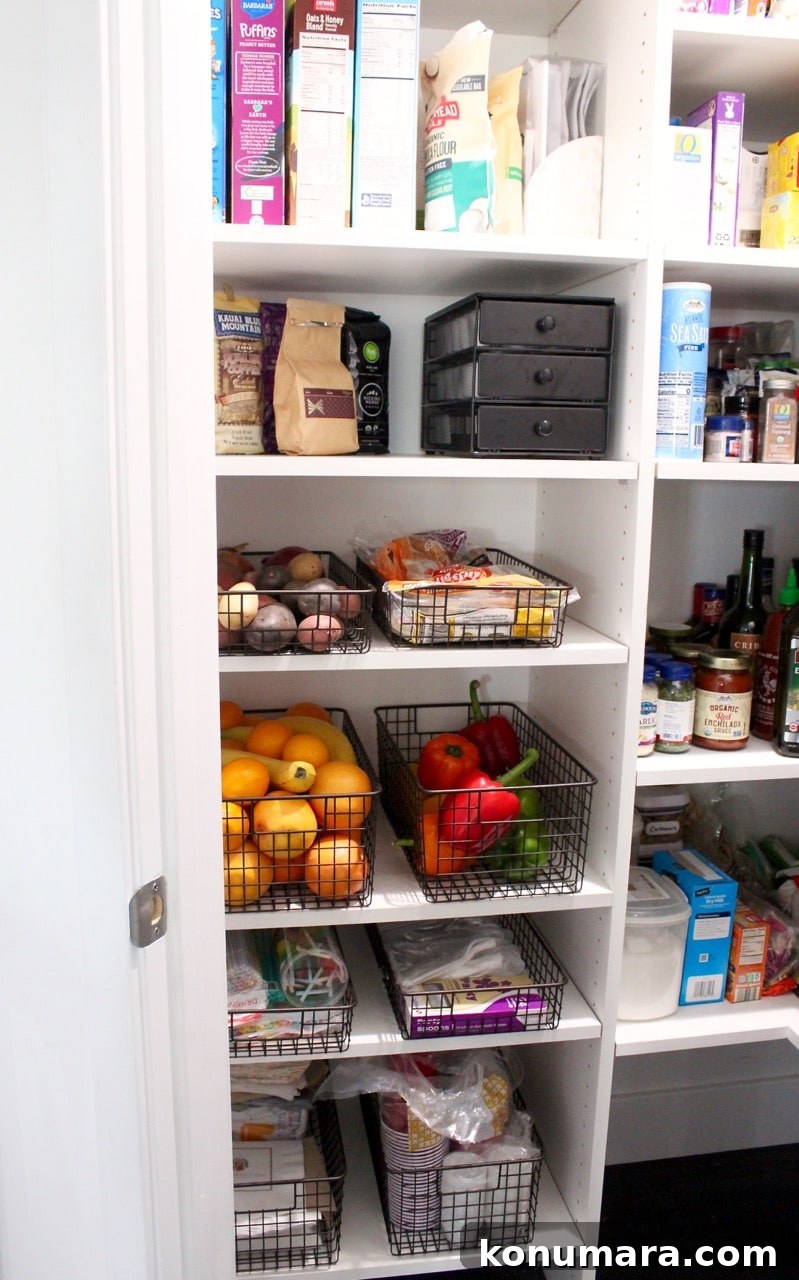 Kitchen pantry organization for fruit, veggies and plasticware.