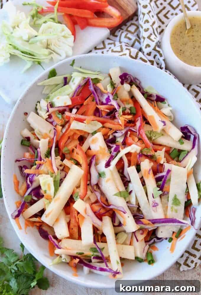Crisp Jicama Slaw with Lime and Cilantro 2 jicama slaw in bowl
