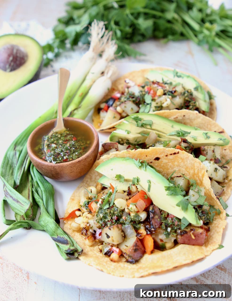Vegan Grilled Veggie Tacos with Chimichurri 5 Grilled Vegan Tacos with Potatoes, Peppers, Avocado and Chimichurri Sauce