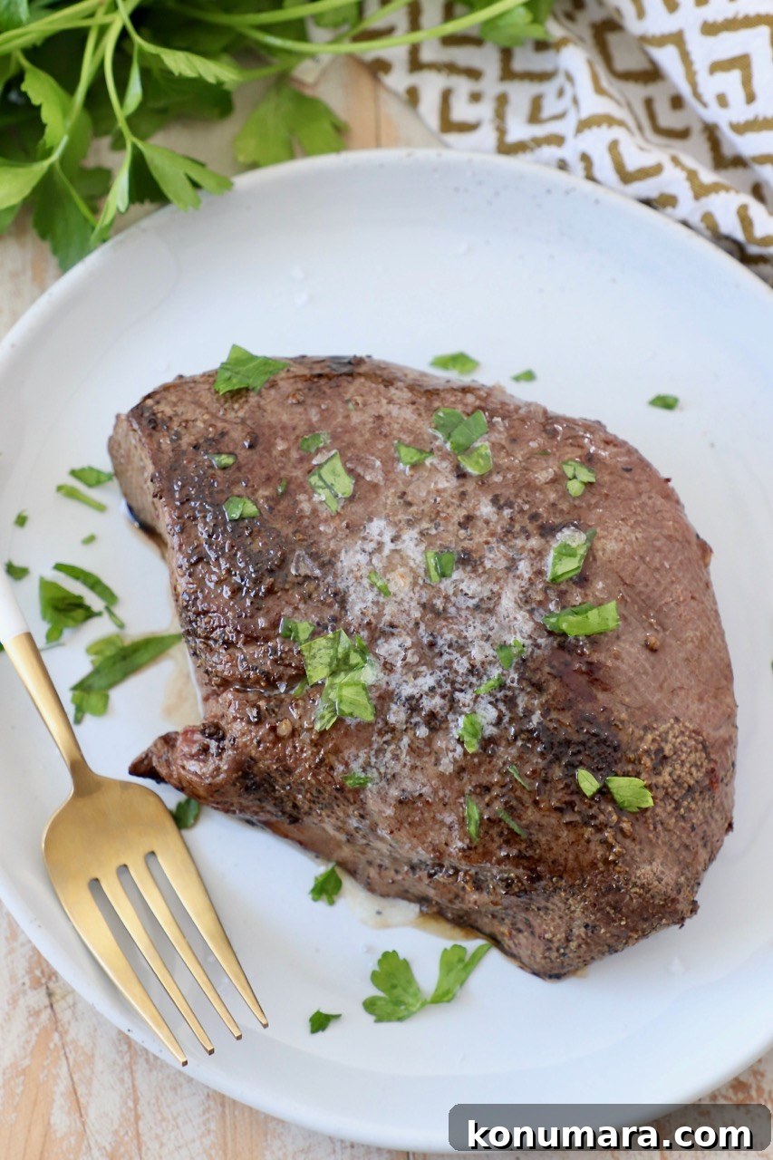 cooked steak on plate with fork