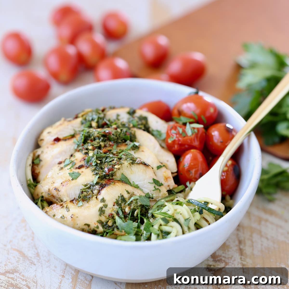 Zucchini Noodles in Gold Fork with Grilled Chimichurri Chicken and Roasted Cherry Tomatoes