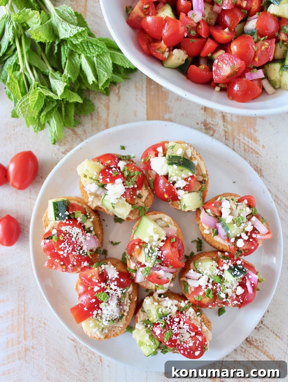 Greek Bruschetta with Feta, Tomato and Olive Tapenade 3 Tomato Cucumber Greek Bruschetta on Toasted Bread, topped with Garlic Hummus and Feta Cheese