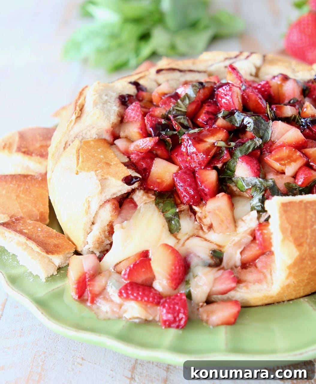 Baked Brie in Sourdough Bread Bowl with Strawberries and Balsamic Glaze