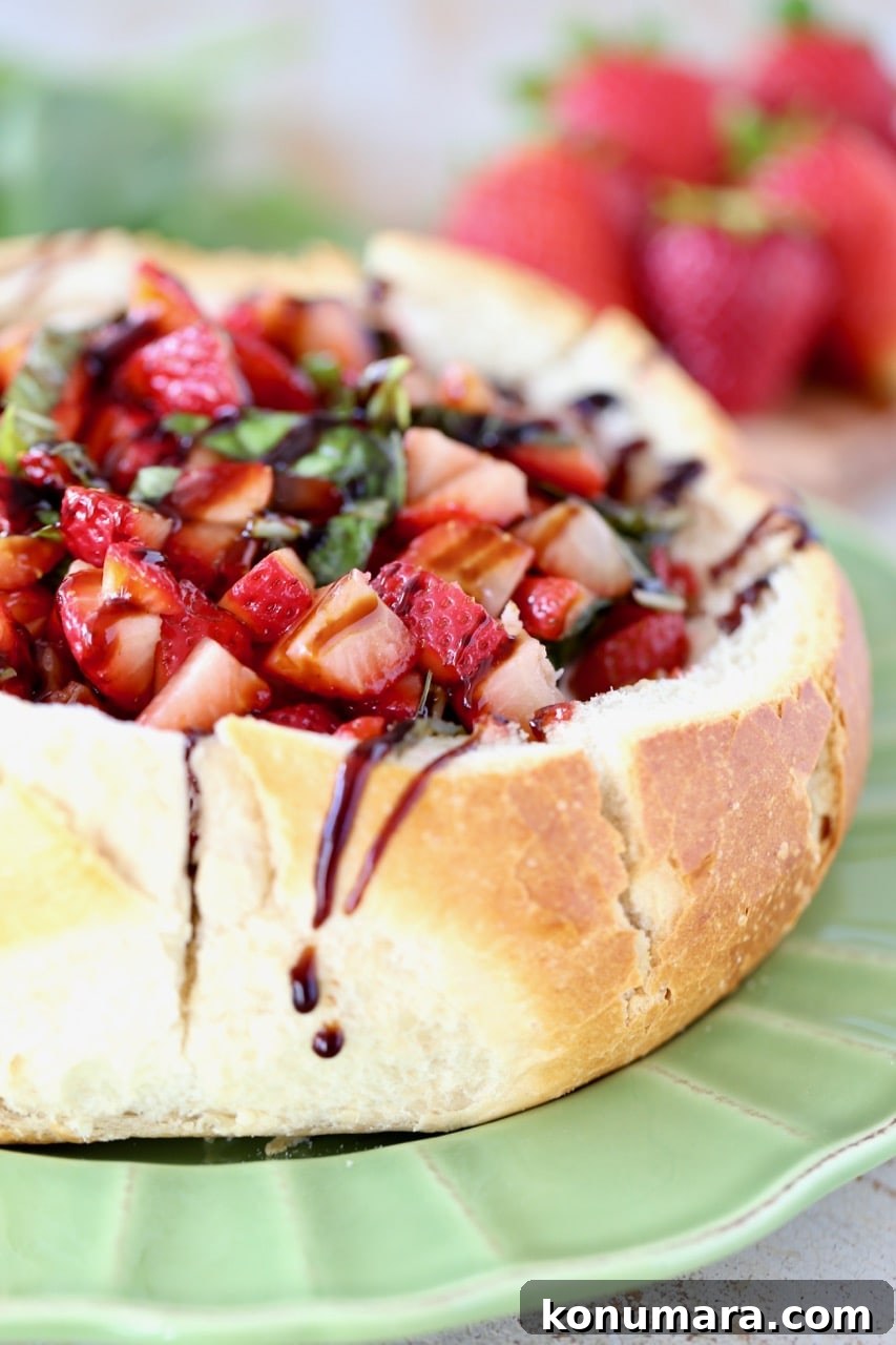 Strawberry Balsamic Baked Brie Bread Bowl on Green Plate