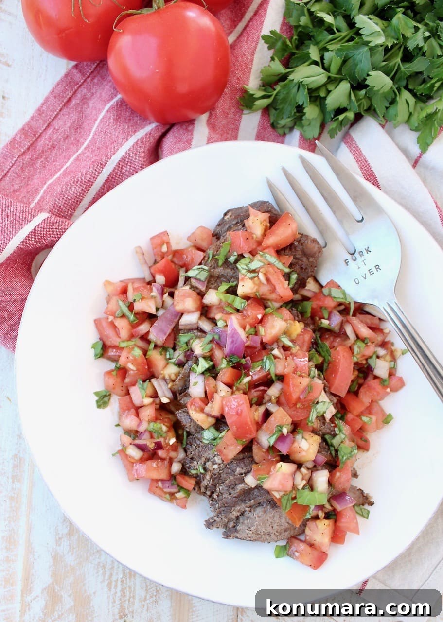 Instant Pot Beef sliced and topped with Tomato Basil Bruschetta