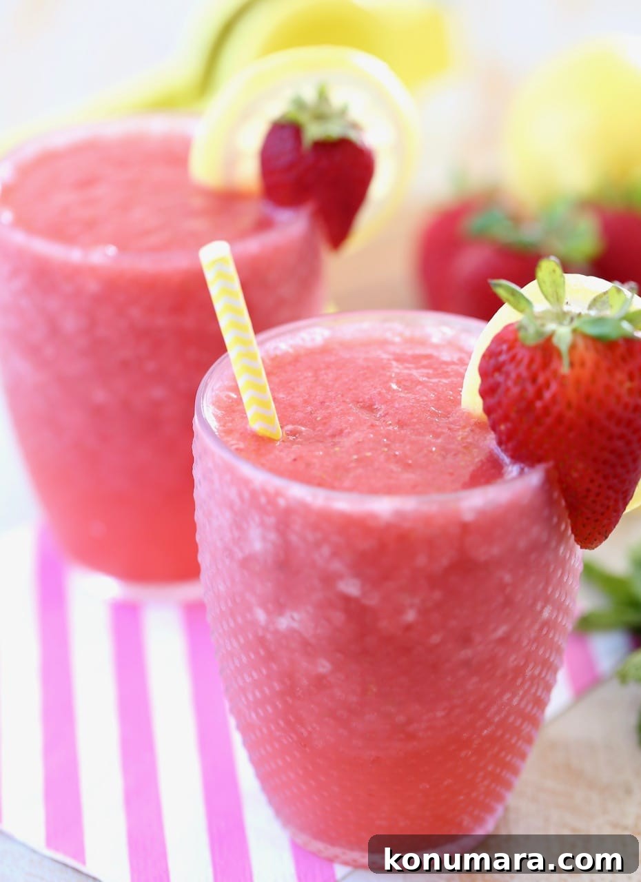 Lemon Berry White Wine Slushes with Fresh Strawberries and Lemons