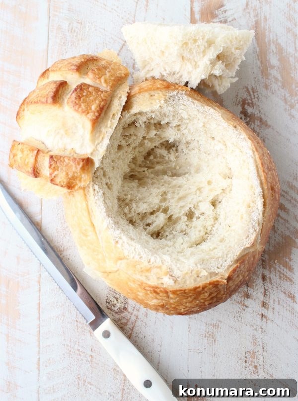 bread bowl with the top cut off and middle sliced out